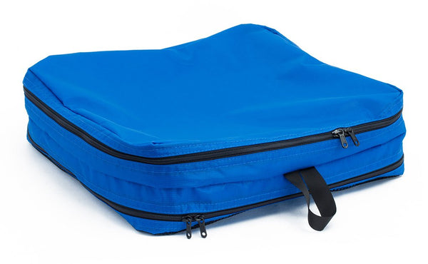 An empty and zipped closed Island (blue) Aether Large Laundry Aeronaut 45 Packing Cube all-fabric side up.
